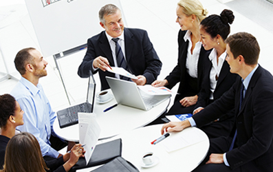 Business group meeting portrait - Five business people working together. A diverse work group.