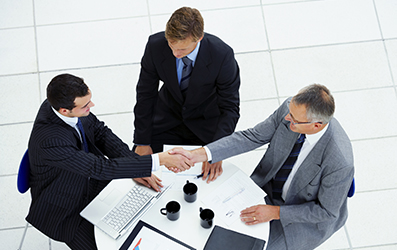 Creative businessgroup working together at a meeting. Taken from above.